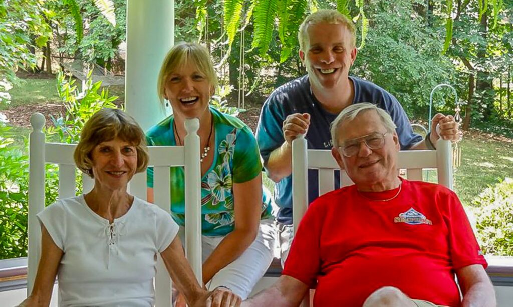Ole and Ane Gade with their two children, luggage ready for the next adventure